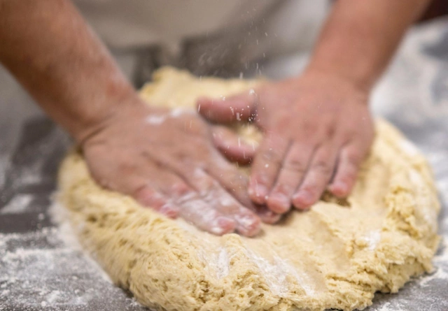 Bakers preparing pasties for the oven