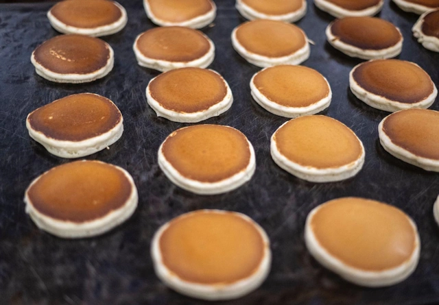 Bakers preparing pasties for the oven