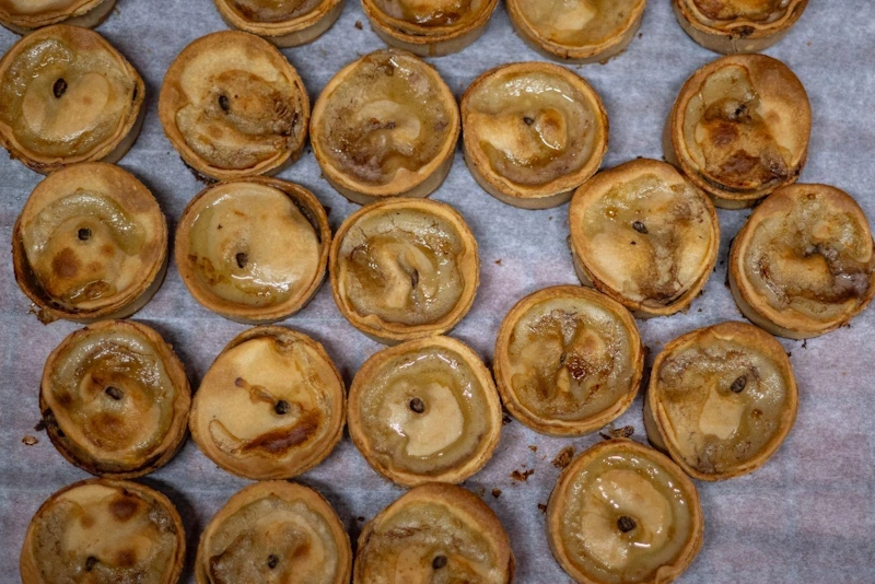 Bakers preparing pasties for the oven