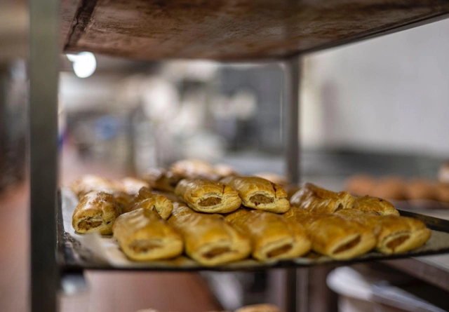 Bakers preparing pasties for the oven